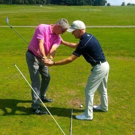 Ian Lee in the middle of an assessment with a golfer